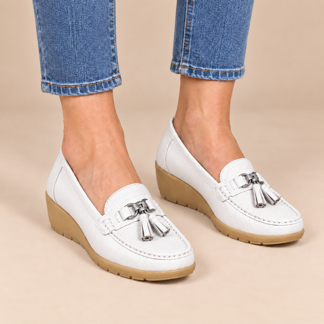 Leren damesloafers met sleehakzool en kwastjes