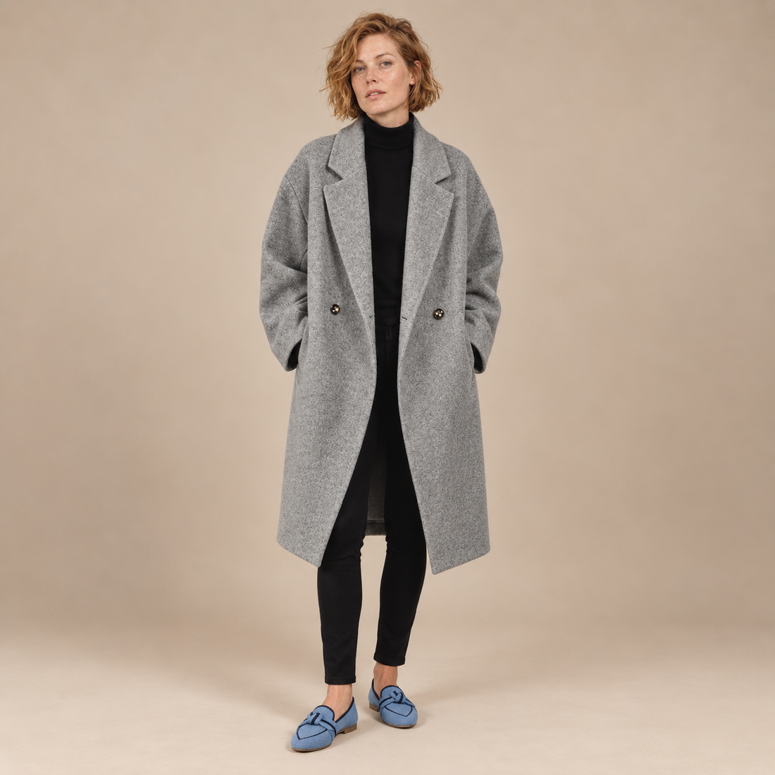 Oversized lange damesjas met klassieke revers