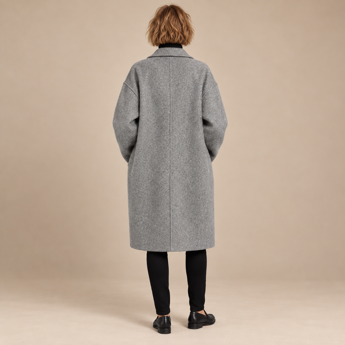 Oversized lange damesjas met klassieke revers
