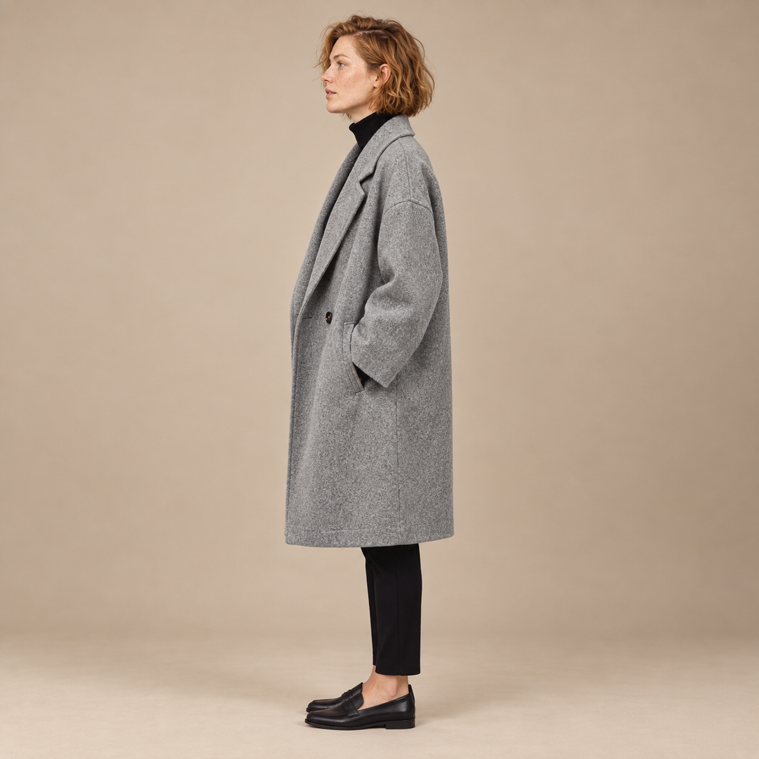 Oversized lange damesjas met klassieke revers