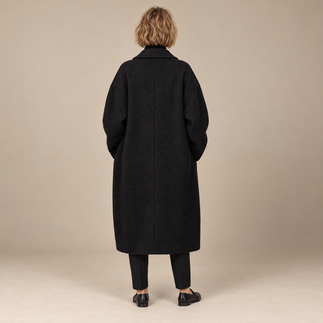 Oversized lange damesjas met klassieke revers