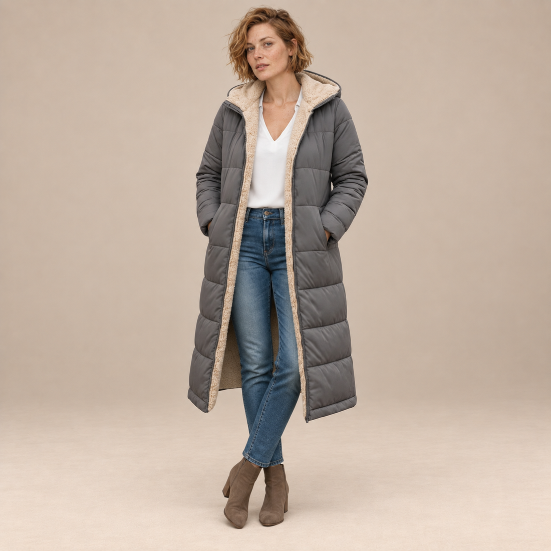 Lange damesjas met capuchon en rits