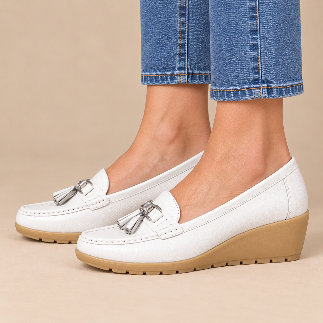 Leren damesloafers met sleehakzool en kwastjes
