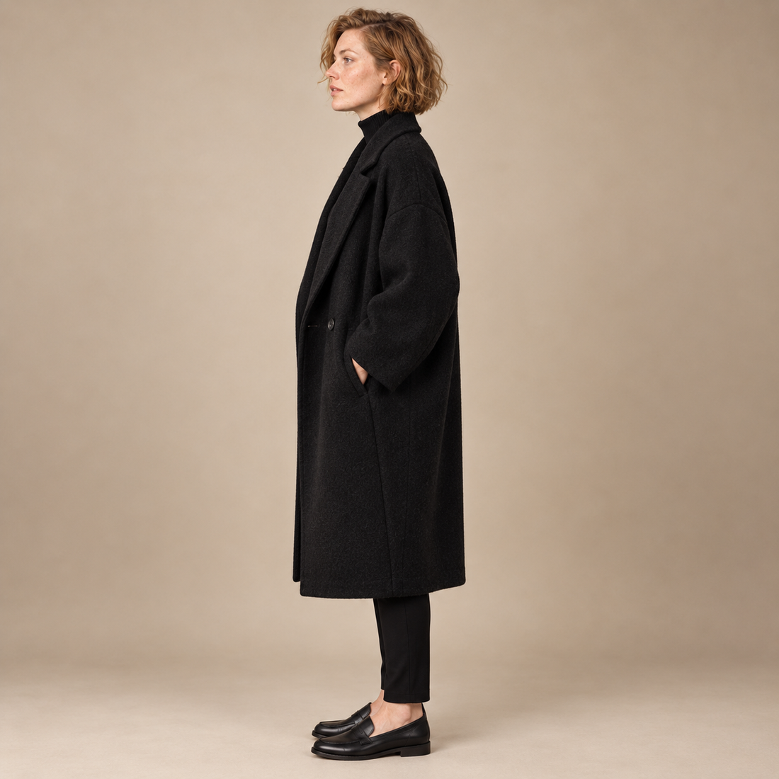 Oversized lange damesjas met klassieke revers
