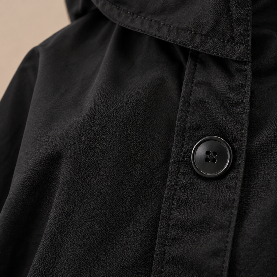 Lange damestrenchcoat met capuchon en knoopsluiting