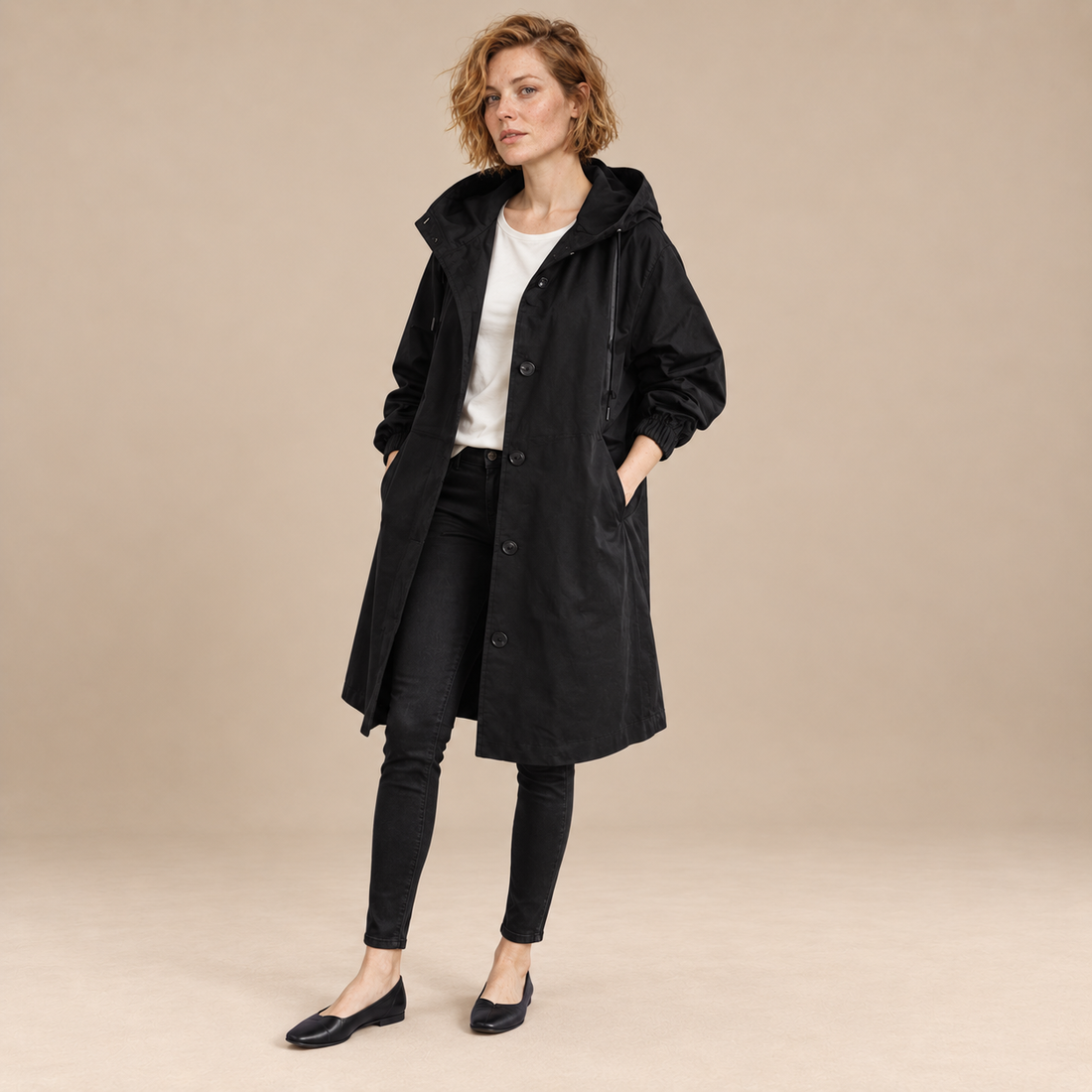 Lange damestrenchcoat met capuchon en knoopsluiting